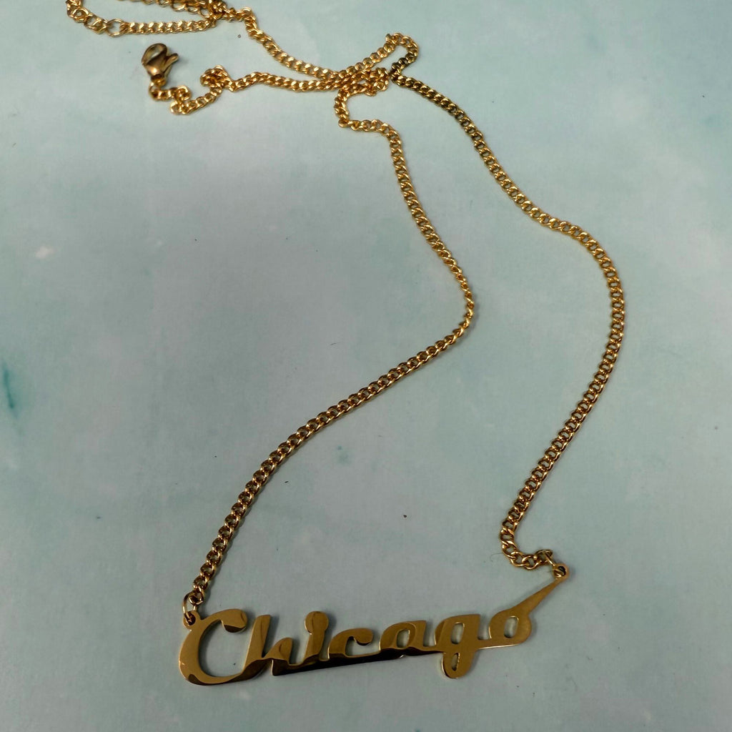 Gold Chicago script necklace on fine chain