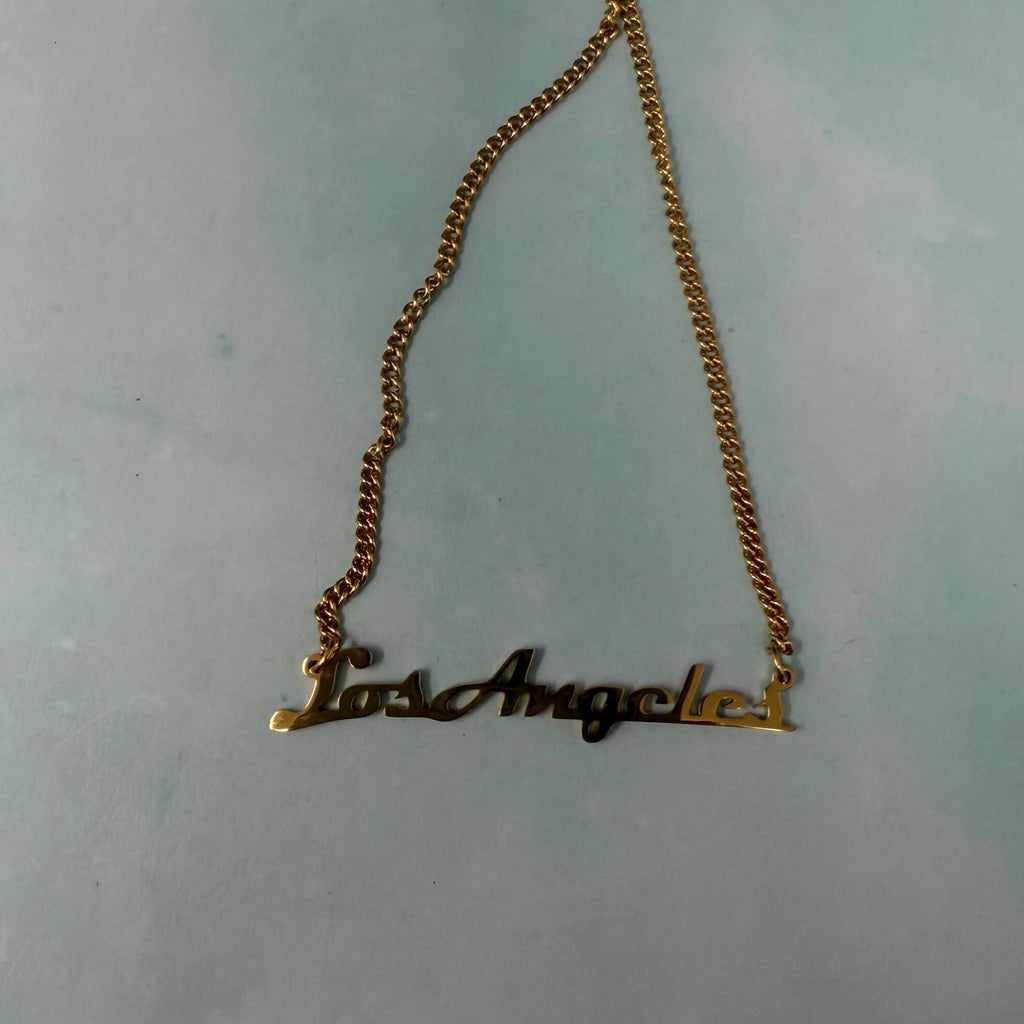 Los Angeles gold name necklace with cursive text