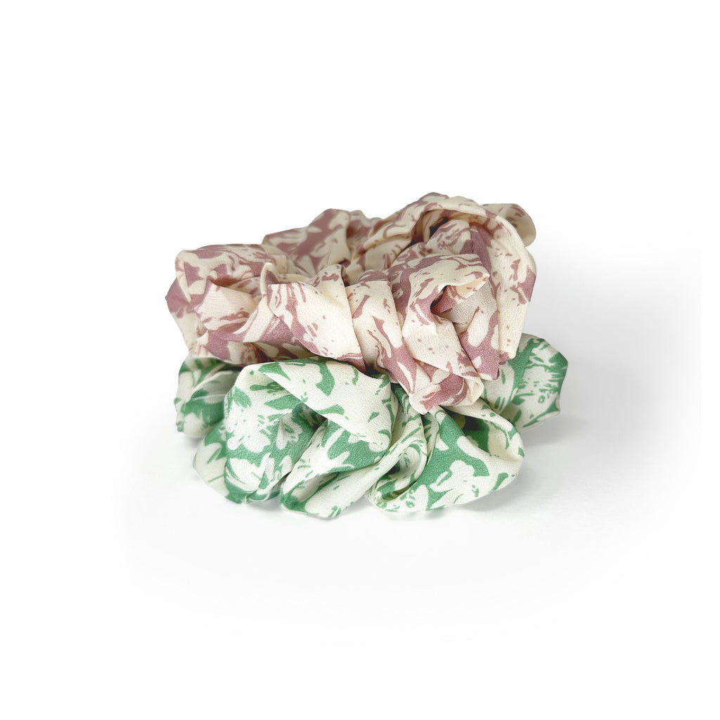Soft oversized scrunchie in floral, leopard, and dotted patterns, perfect for stylish everyday hair looks.
