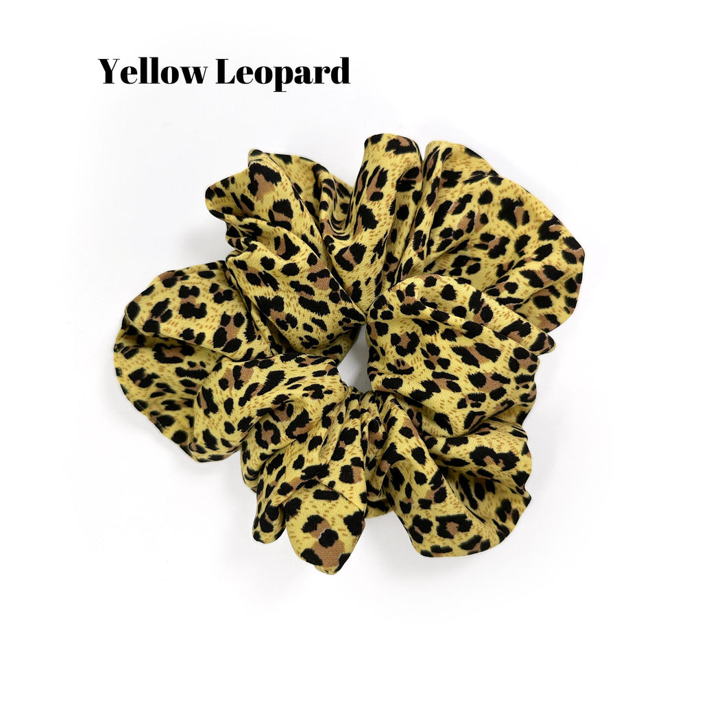 Soft oversized scrunchie in floral, leopard, and dotted patterns, perfect for stylish everyday hair looks.