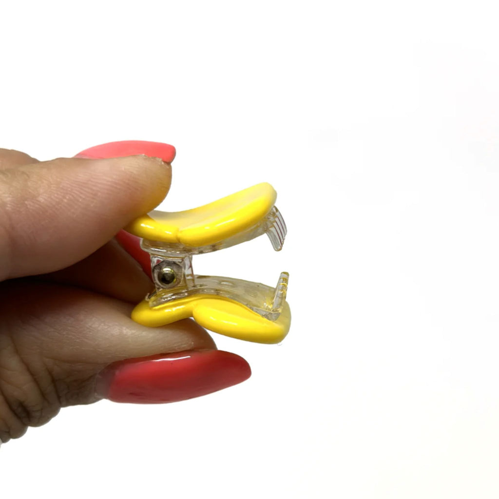 Set of two mini heart-shaped hair claws in shimmery beige and solid colors, made from durable acrylic with strong spring closure, each measuring approximately 1"H x 1"W.