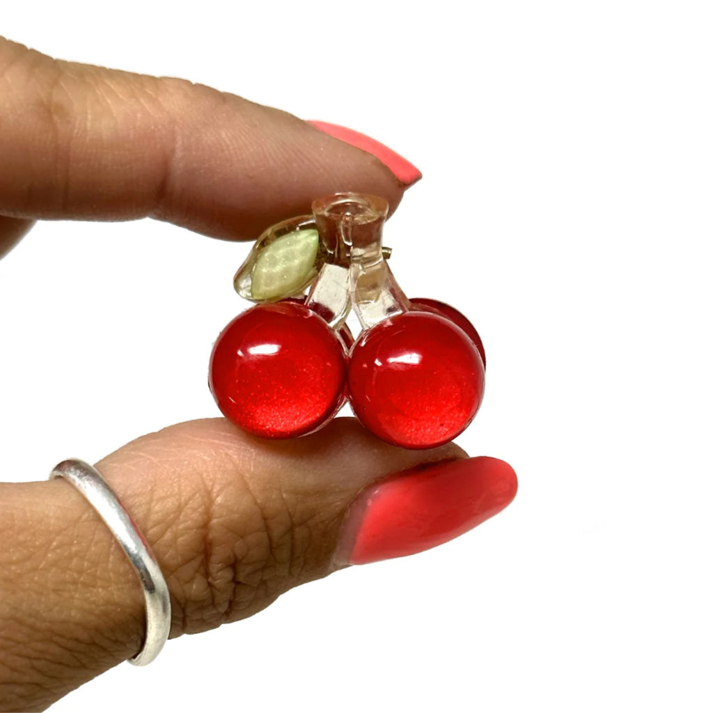 Set of two mini cherry-shaped hair claws made from durable acrylic with a strong spring closure, each measuring approximately 1.25"H x 1"W.
