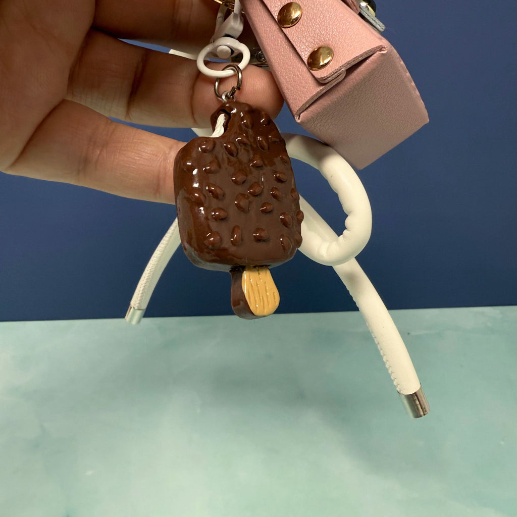 Pink owl and ice cream charm keychain with white bow and tassel on gold keyring