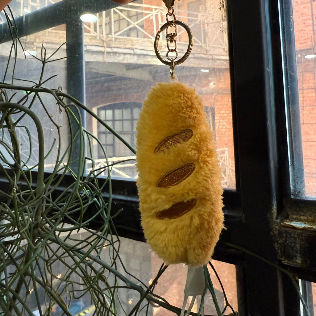 Yellow plush triangle cheese keychain with embroidered holes, approx. 4 inches tall