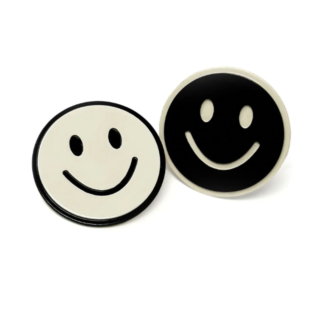 Set of two black and white smiley face hair clips with alligator clip backing, each measuring approximately 1.25" in diameter.