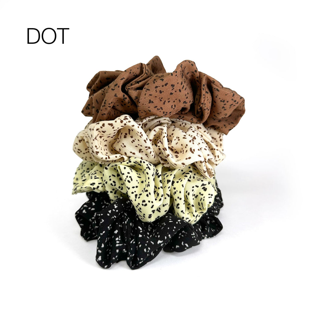 Soft oversized scrunchie in floral, leopard, and dotted patterns, perfect for stylish everyday hair looks.