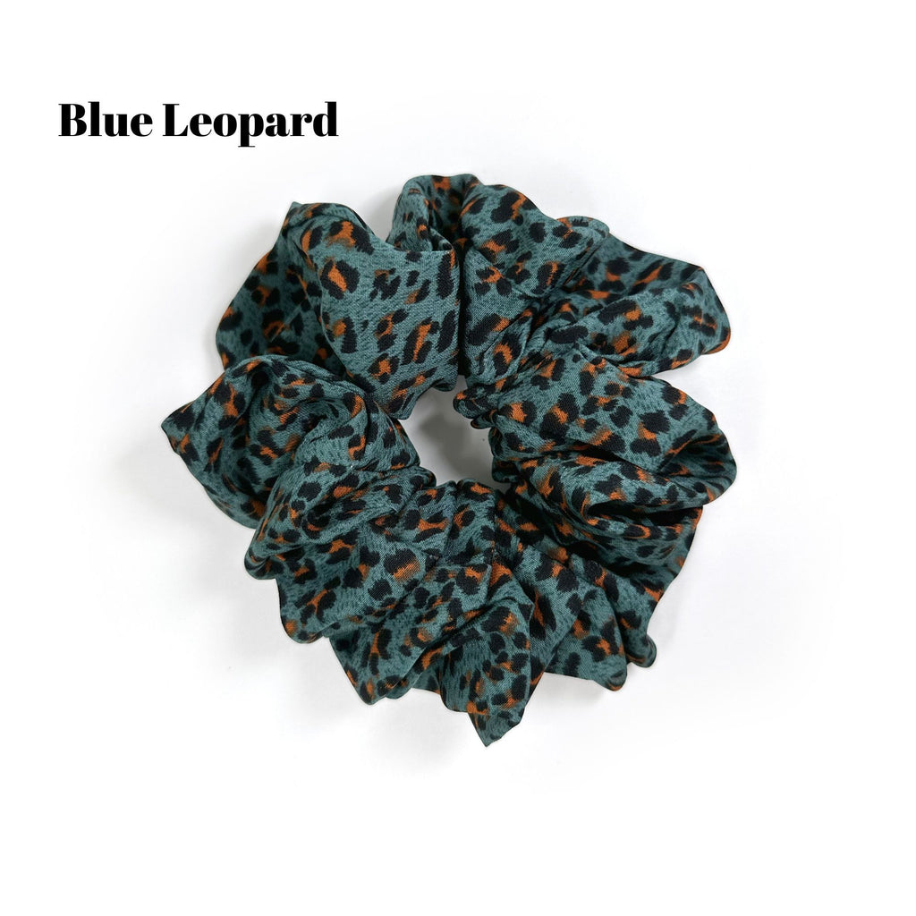 Soft oversized scrunchie in floral, leopard, and dotted patterns, perfect for stylish everyday hair looks.