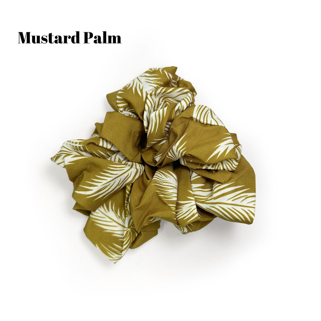 Soft oversized scrunchie in floral, leopard, and dotted patterns, perfect for stylish everyday hair looks.