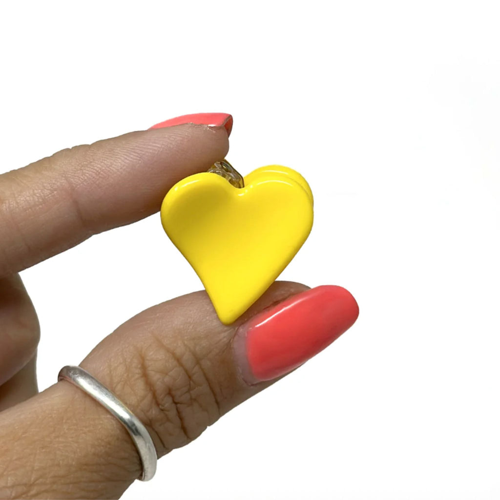 Set of two mini heart-shaped hair claws in shimmery beige and solid colors, made from durable acrylic with strong spring closure, each measuring approximately 1"H x 1"W.