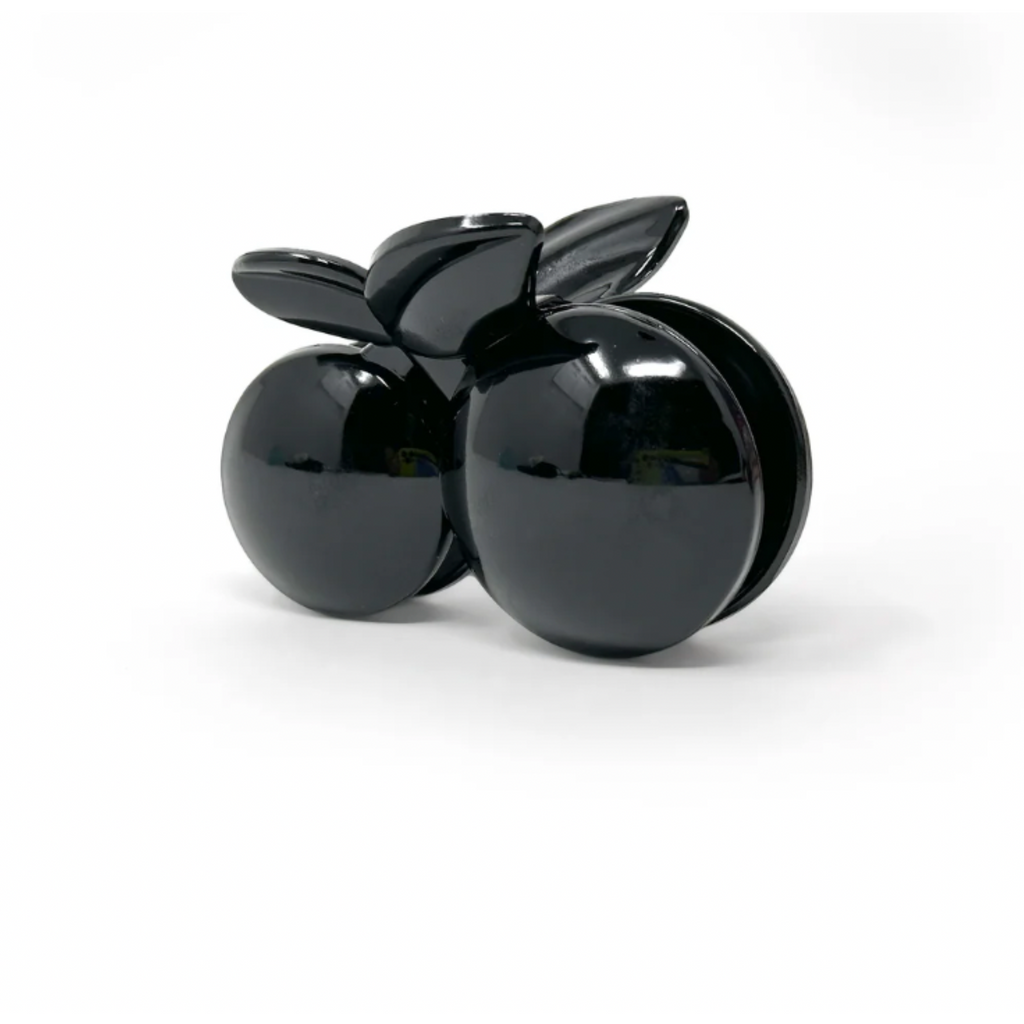 Oversized acrylic cherry hair claw clip in neutral tones with double-ball fruit design and strong grip