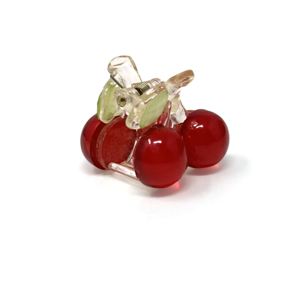 Set of two mini cherry-shaped hair claws made from durable acrylic with a strong spring closure, each measuring approximately 1.25"H x 1"W.