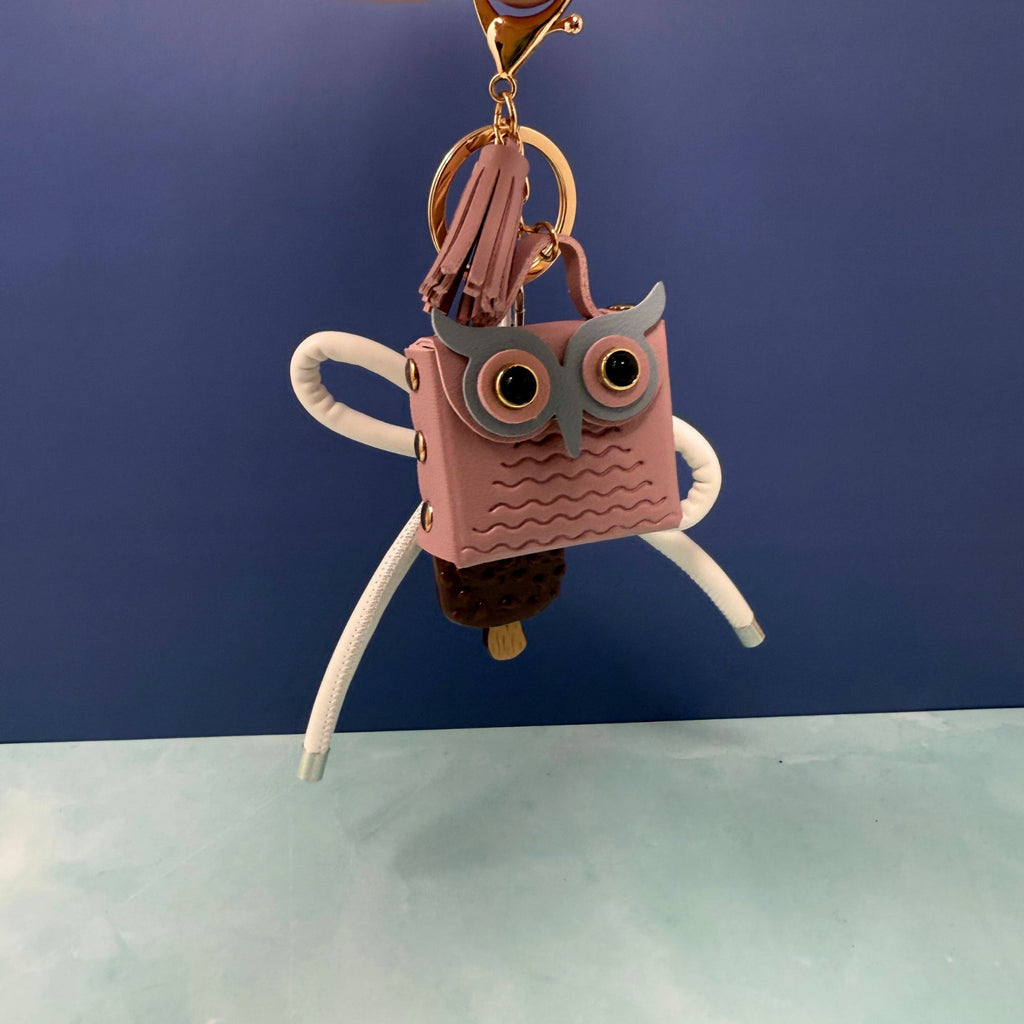 Pink owl and ice cream charm keychain with white bow and tassel on gold keyring