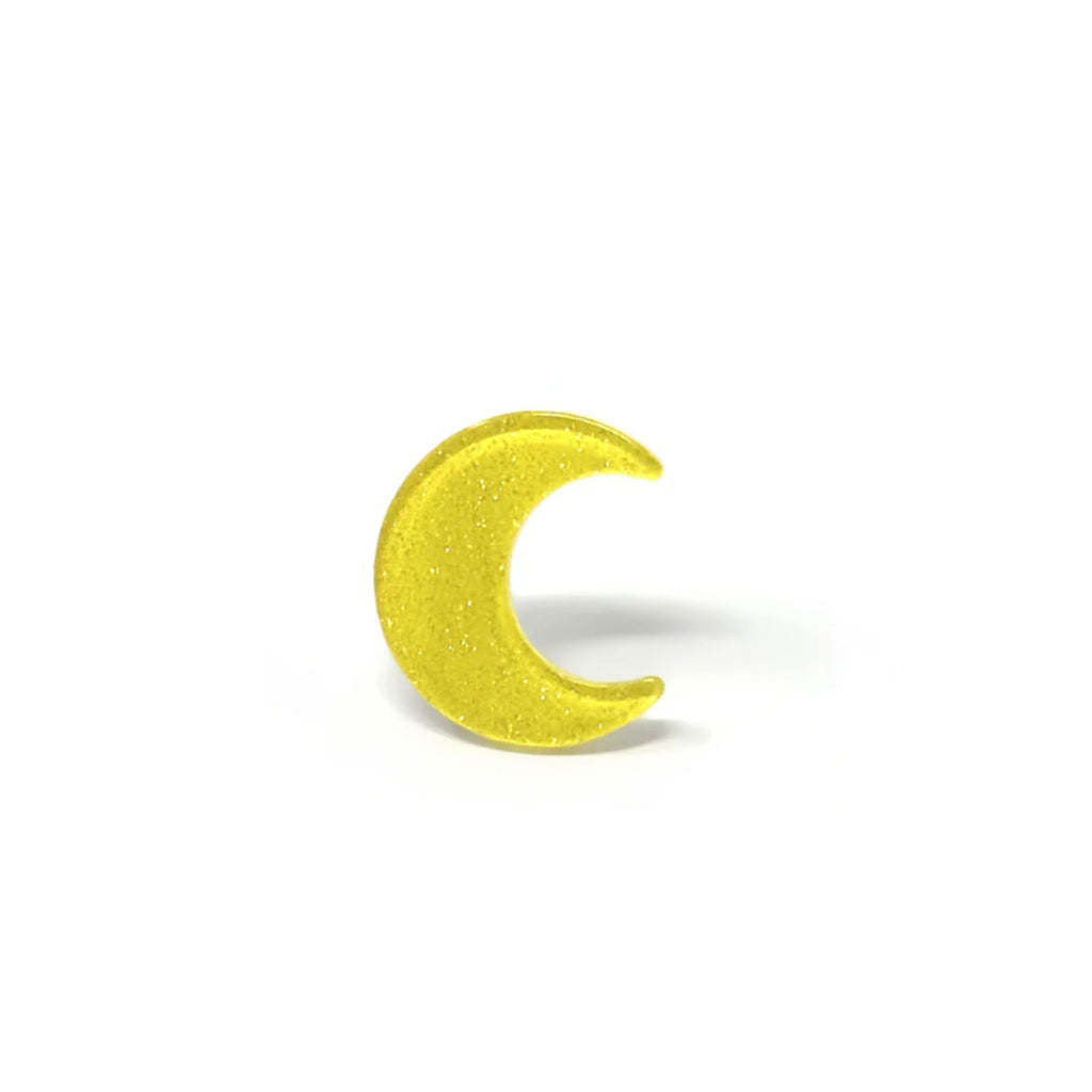 Set of two glittery crescent moon hair clips with secure alligator clip backing, each measuring 0.875" wide by 1" high.