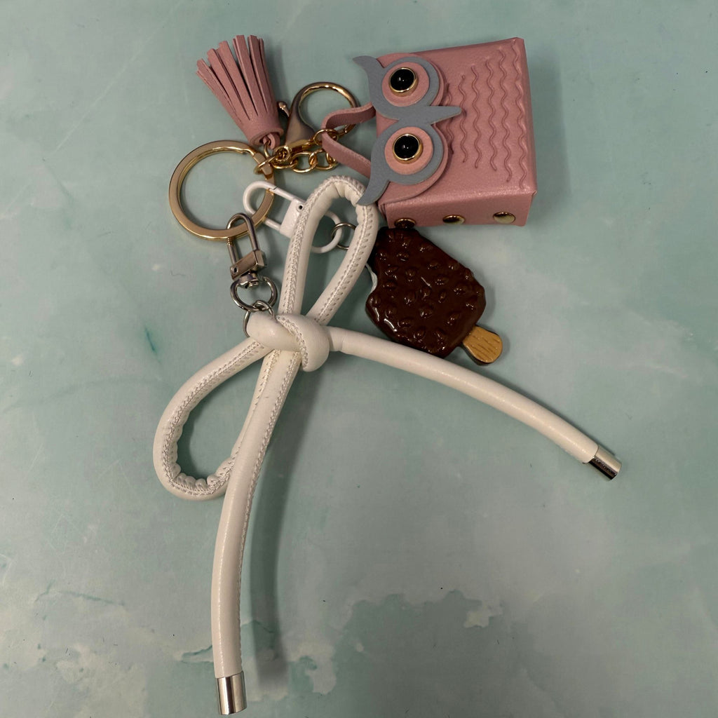 Pink owl and ice cream charm keychain with white bow and tassel on gold keyring