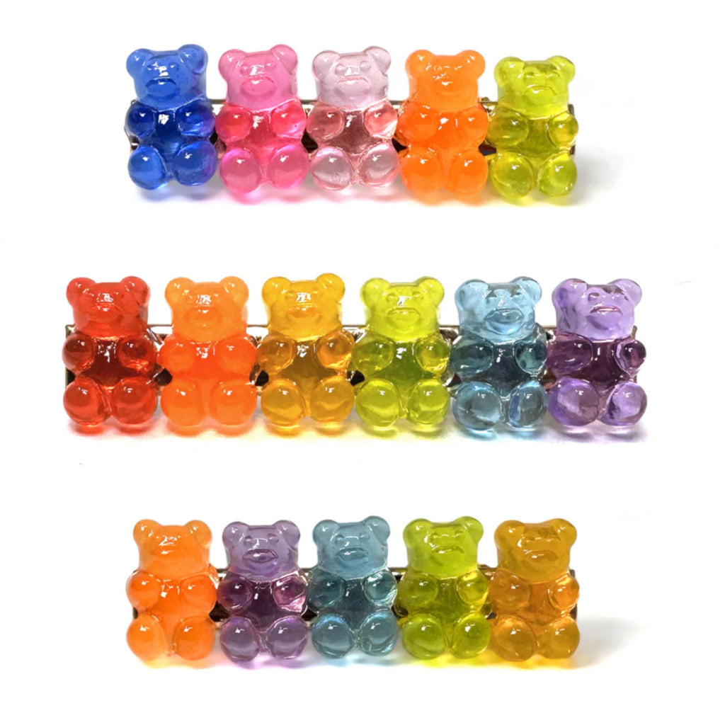 Set of two candy-inspired gummy bear barrettes with colorful bear designs, available in 6 Across (2.5"W x 0.75"H) and 5 Across (2.25"W x 0.75"H) styles, featuring sturdy alligator clip backings.