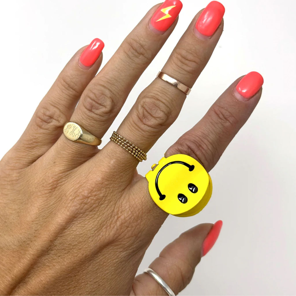 Set of two mini smiley face hair claws, 1 inch in diameter, with cheerful yellow smiley designs.