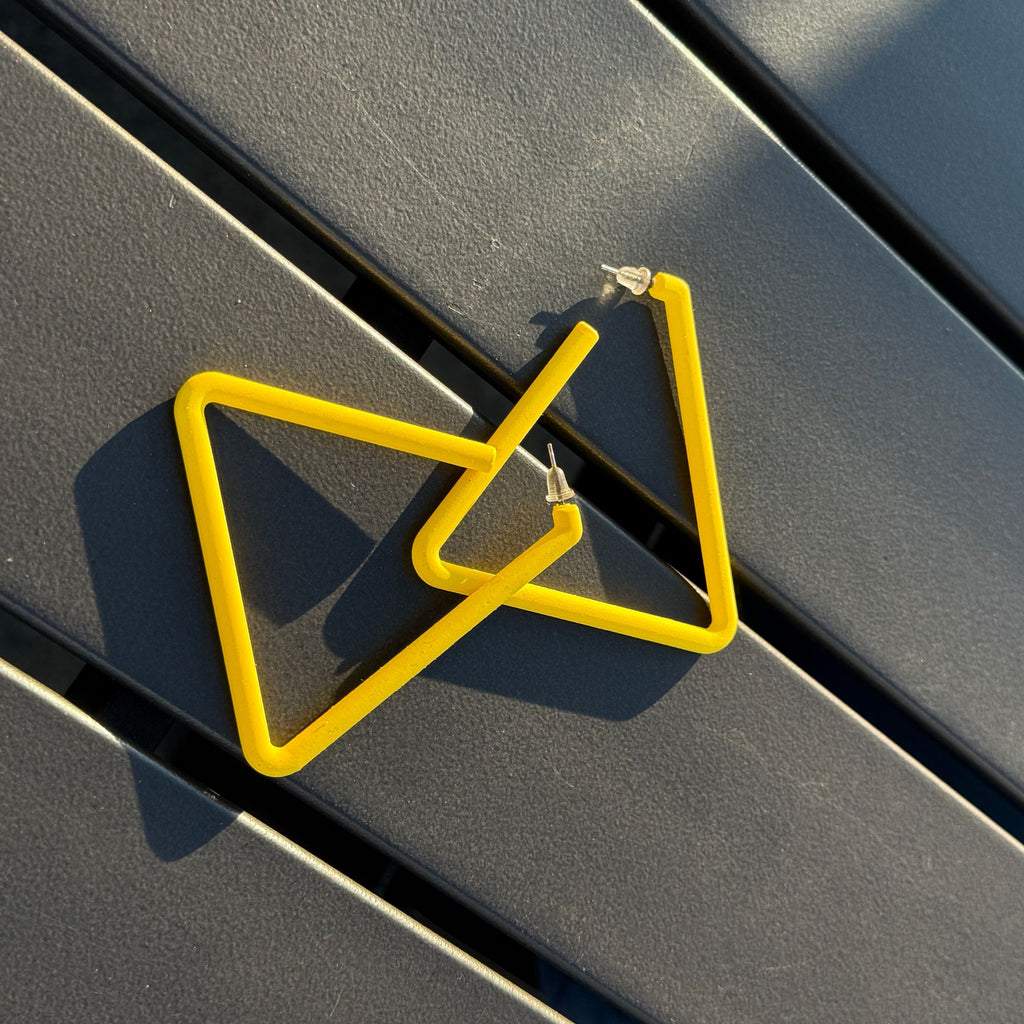 Yellow geometric design on a dark surface