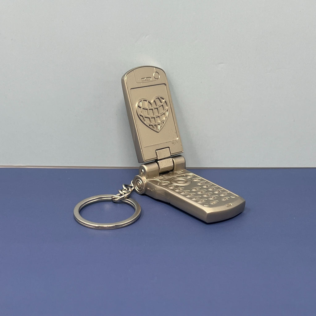 Metallic Y2K flip phone keychain with retro 90s design and silver keyring chain

