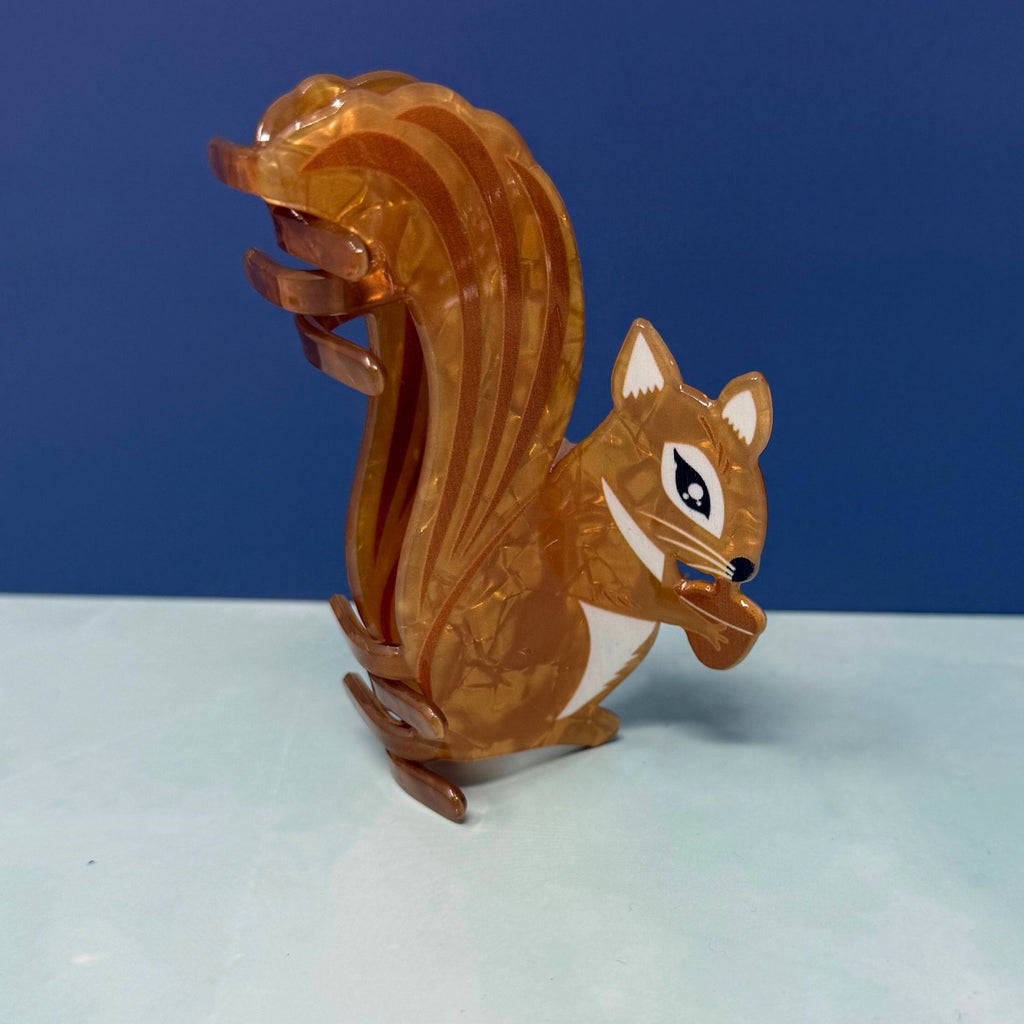 Squirrel hair claw clip with amber acetate finish, bushy tail design, and strong claw grip
