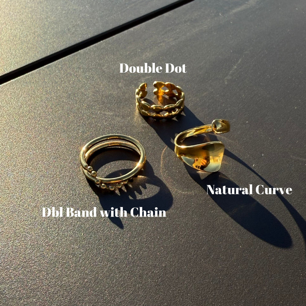 Three gold rings on a dark surface with 'Double Dot' and 'Natural Curve' labels.