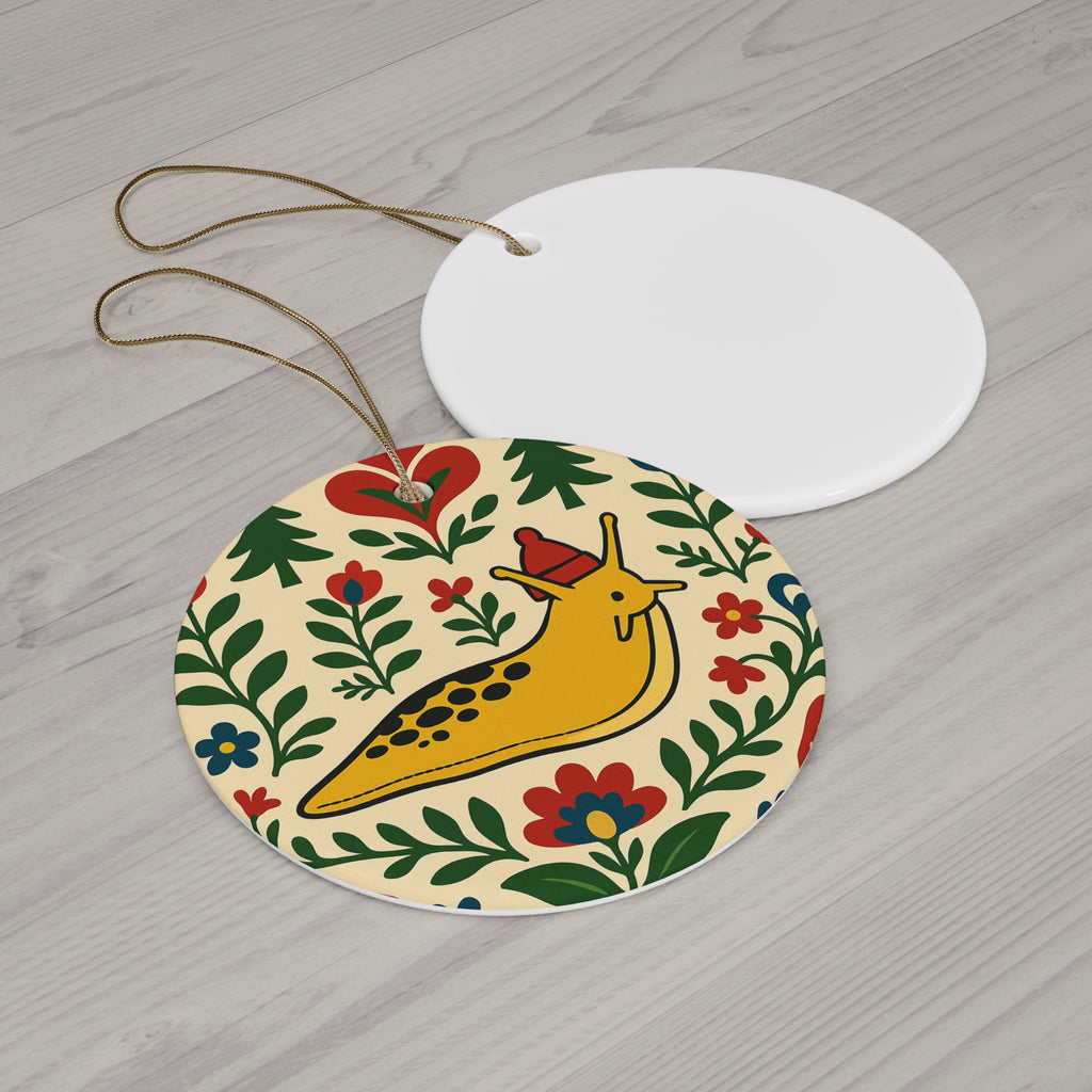 Decorative round ornament with a snail design on a wooden surface