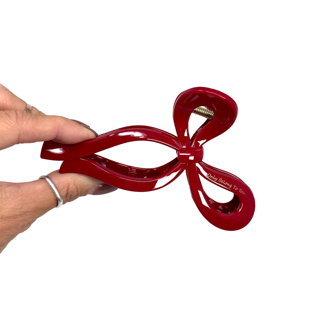 "Ruby Ribbon Hair Claw Clip featuring a chic bow-inspired design."