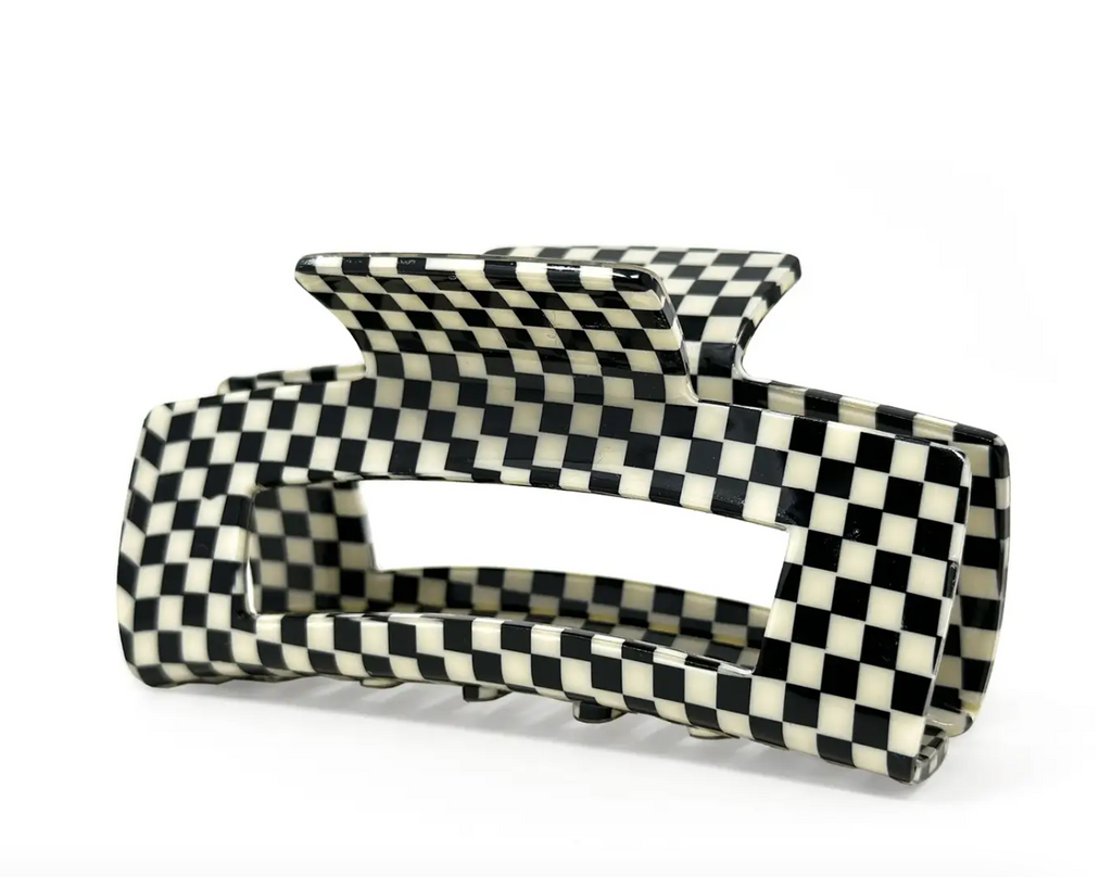 Black and white checkered hair claw clip with a classic and trendy design.